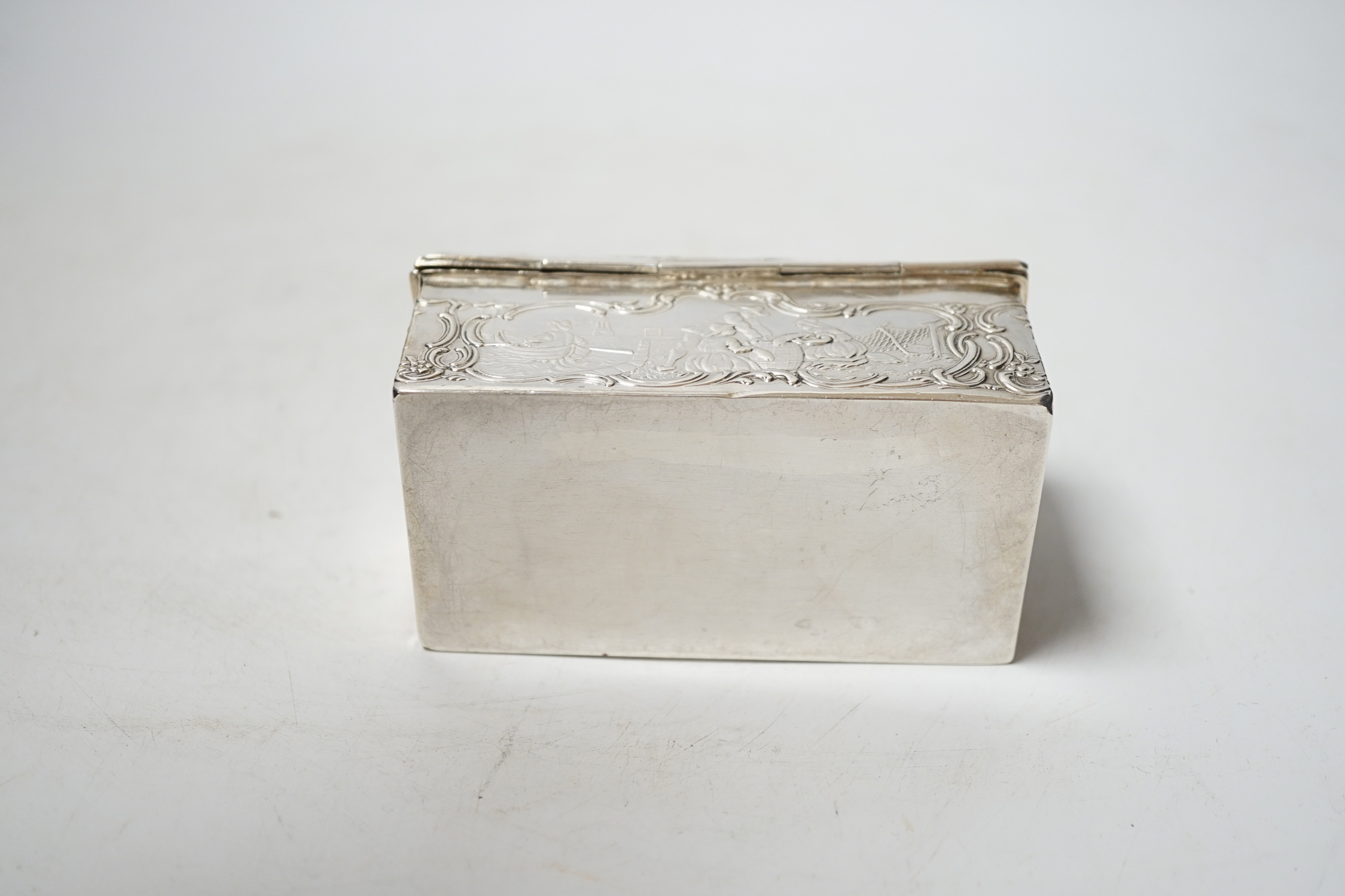 An early 20th century repousse Hanau silver box, modelled as a travelling trunk, import marks for Berthold Muller, Chester, 1903, width, 10cm.